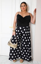 Pantalón ancho curvy de Boutiquemirel con estampado de lunares polka dots, tela ligera y ajuste cómodo para mujer.