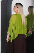 Blusa de seda con brillos