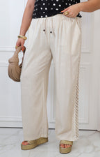 Pantalón beige con bordado