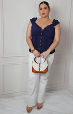 Blusa con olanes fruncidos y botones
