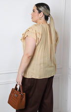 Blusa con olanes y lazo en el cuello