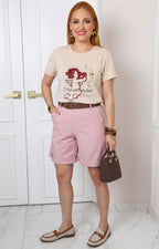 Blusa con estampado de cupido y aplicaciones