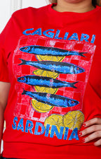 Blusa roja con aplicaciones brillantes