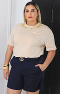 Blusa lisa con aplicaciones