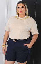 Blusa lisa con aplicaciones