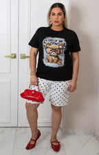 Blusa negra con estampado de osito y aplicaciones