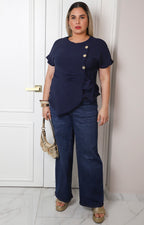 Blusa con lazo y botones dorados