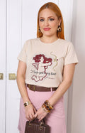Blusa con estampado de cupido y aplicaciones