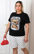 Blusa negra con estampado de osito y aplicaciones