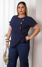 Blusa con lazo y botones dorados