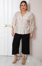 Blusa beige a rayas con detalle dorado