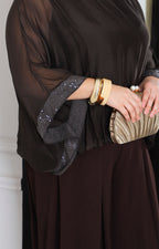 Blusa de seda con brillos