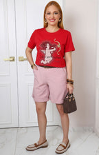 Blusa con estampado de cupido y aplicaciones