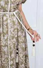 Vestido verde con estampado floral y lazo