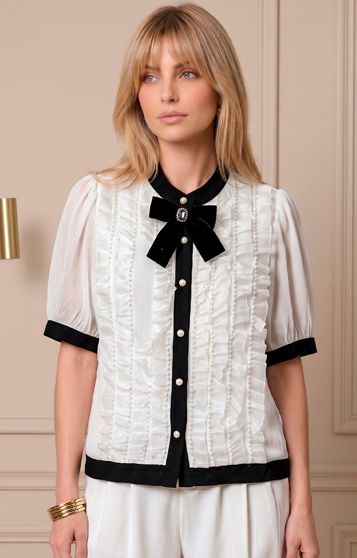 Blusa blanca con moño negro