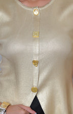 Blusa dorada sin manga de Boutiquemirel con botones, prenda regular y elegante para ocasiones informales y formales.