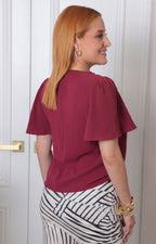Blusa con cuello forrado y mangas campana