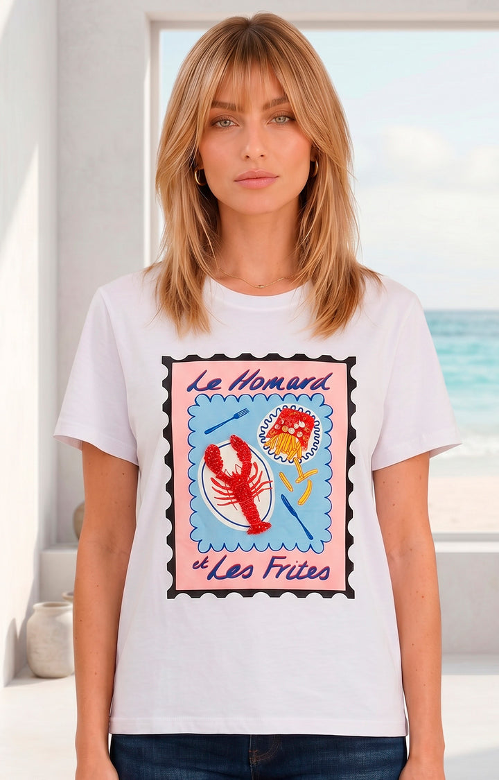 Blusa blanca con estampado y aplicaciones