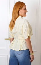 Blusa camisera amarilla tipo peplum