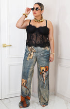 Blusa negra de encaje con tirantes ajustables
