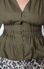 Blusa verde peplum con escote en V