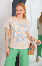 Blusa beige con estampado y detalle 3D
