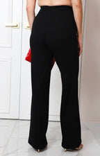Pantalón negro recto con detalle dorado
