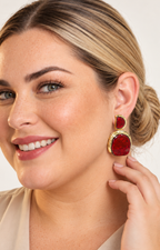 Aretes colgantes dorados con piedra