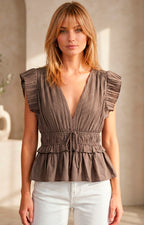 Blusa peplum plisada con volantes