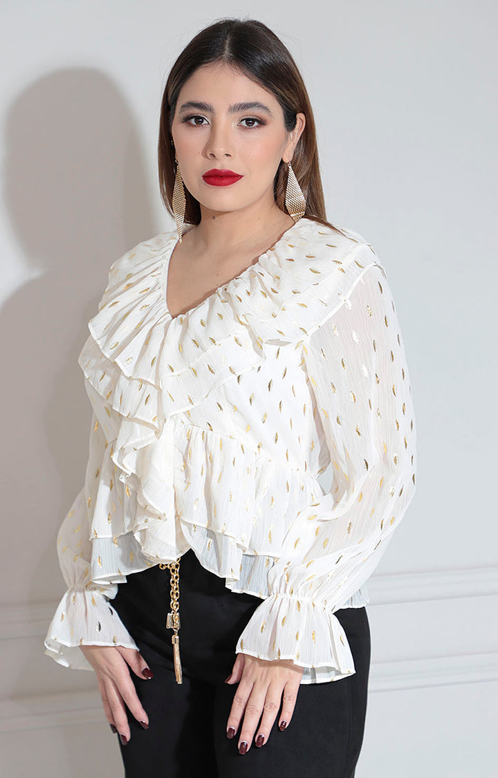 Blusa beige con olanes