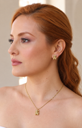 Set de collar y aretes con osito dorado