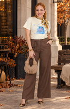 Blusa amarilla con estampado y aplicaciones de brillos