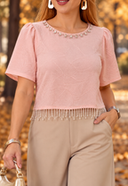 Blusa rosa con aplicaciones