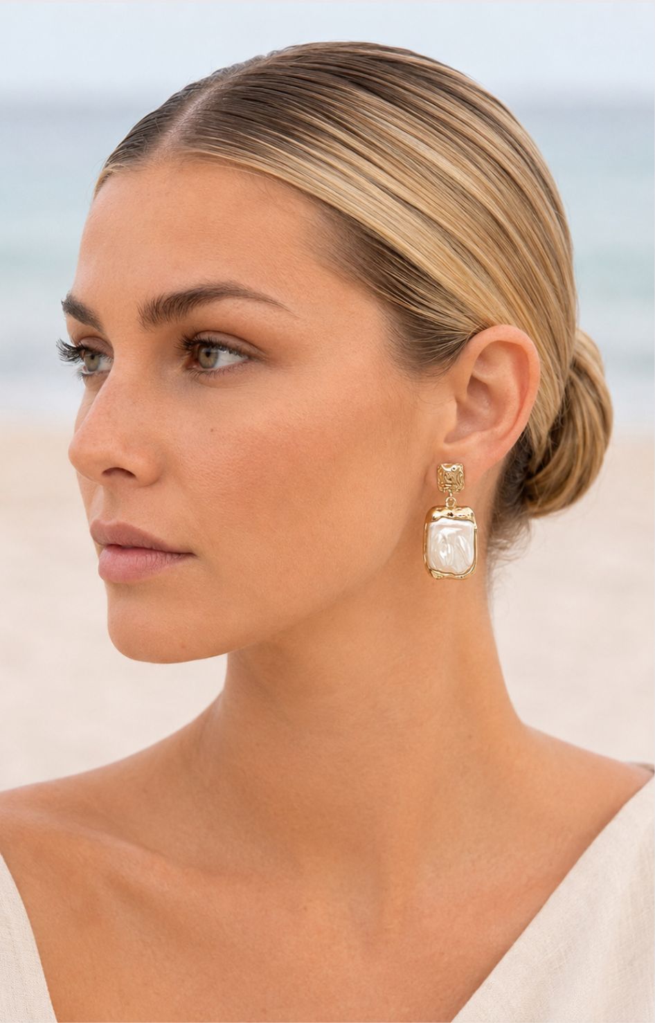 Aretes dorados con perla grande