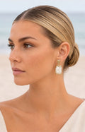 Aretes dorados con perla grande
