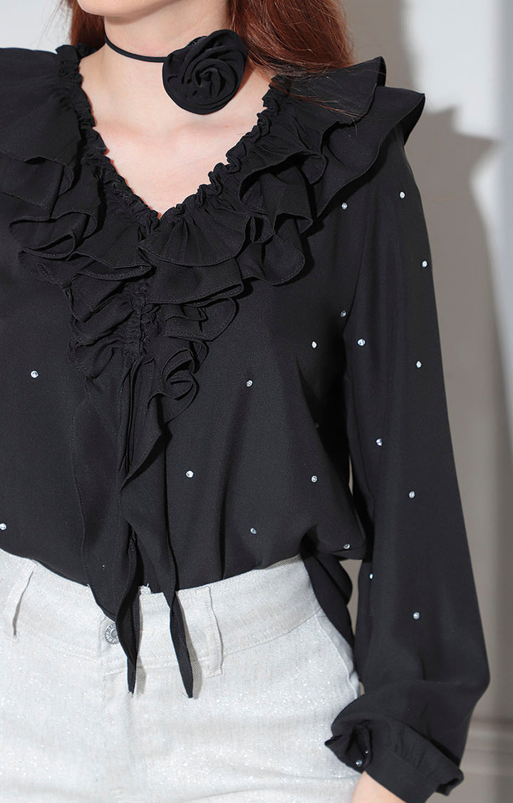 Blusa negra con pedrería