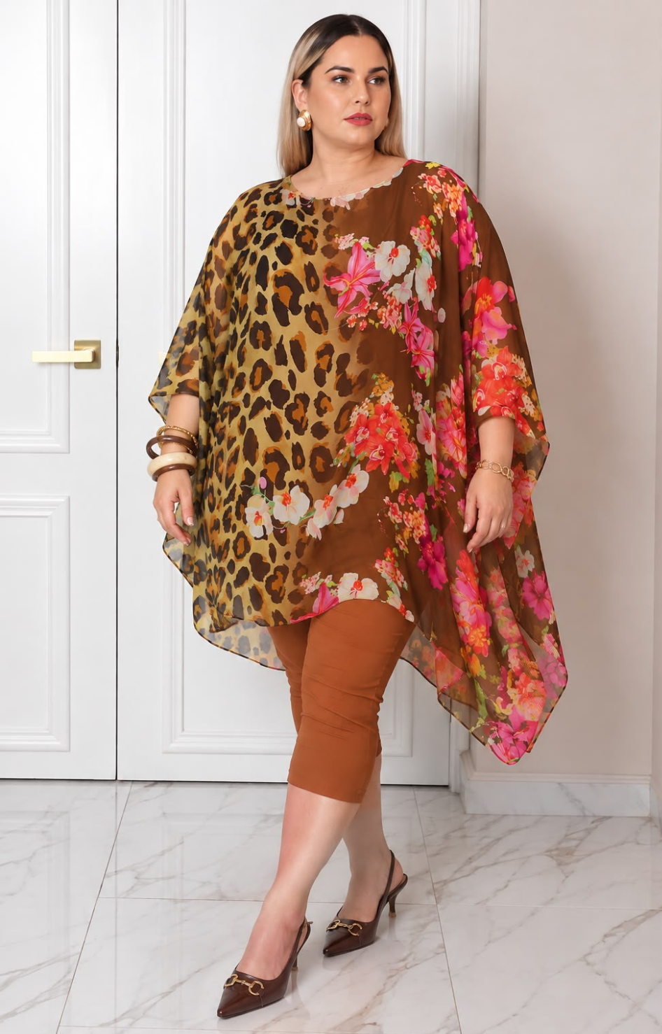 Blusa asimétrica de estampado leopardo y floral de la marca Boutiquemirel, diseñada para curvas, con estilo moderno y llamativo.