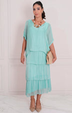 Vestido liso con volantes