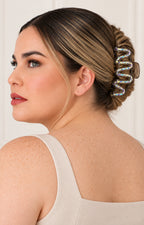 Pinza para cabello metálica Boutiquemirel, herramienta de peluquería con acabado brillante y diseño resistente.